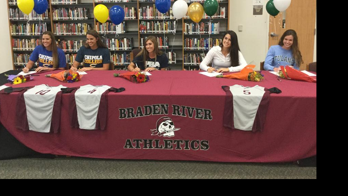 Ali Yawn, center (shown during a signing day ceremony in November), pitched a one-hitter in the Class 7A-District 9 final against Lennard High School on Thursday in Seffner at Armwood High School. Joining Yawn in this photo are Casey and Brooke Farrow (at left) and Sarah Crawford and Emma King (at right).