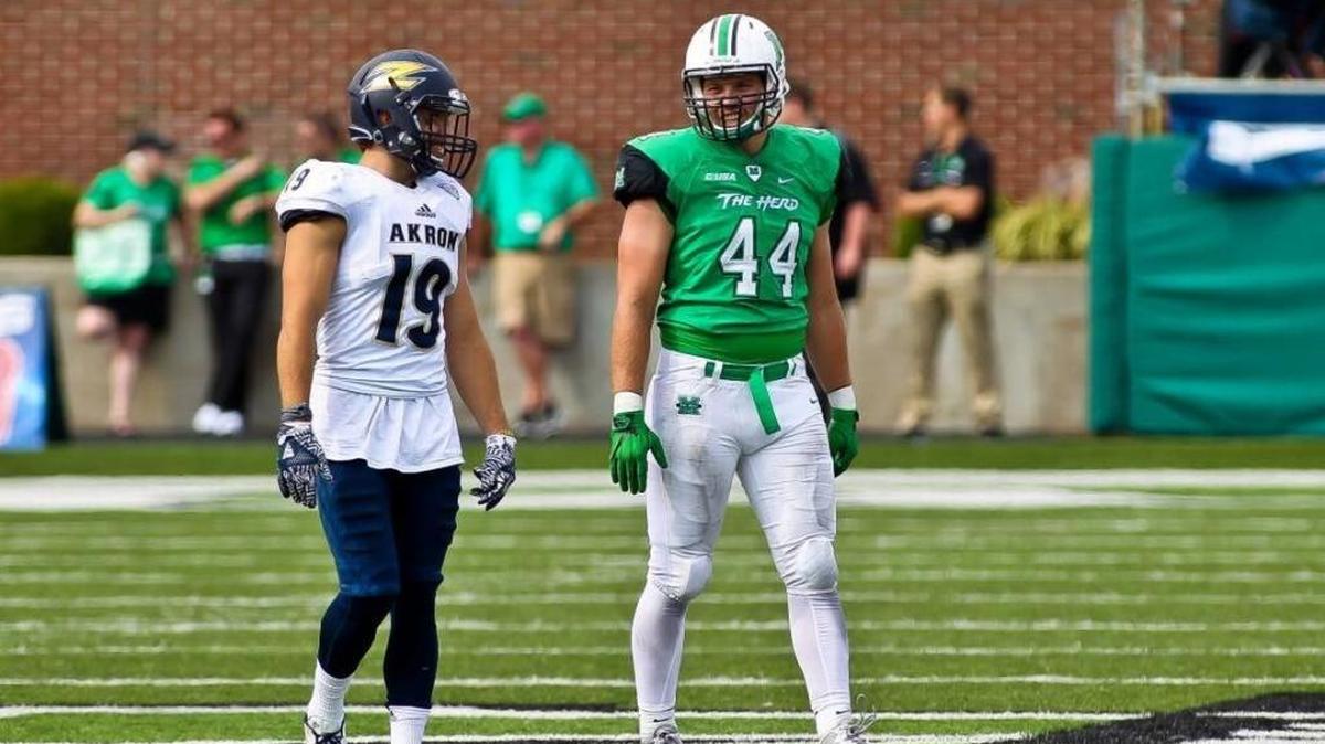 Marshall’s Blake Keller, right, with former Manatee High School teammate Anthony Lauro of Akron during a 2016 game, said his mother recently was diagnosed with breast cancer.