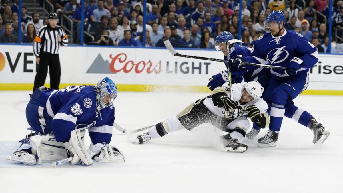 Tampa Bay goalie Andrei Vasilevskiy stops a shot on goal by Pittsburgh left wing Chris Kunitz during the first period of Game 3 Wednesday in Tampa. Lightning left wing Ondrej Palat (18) and defenseman Anton Stralman (6) defend.