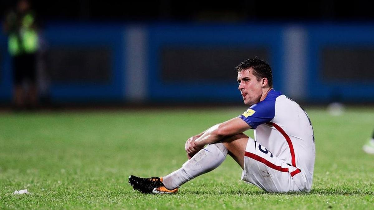 Matt Besler sits on the field dejected after the stunning U.S. 2-1 loss to Trinidad and Tobago on Tuesday night.