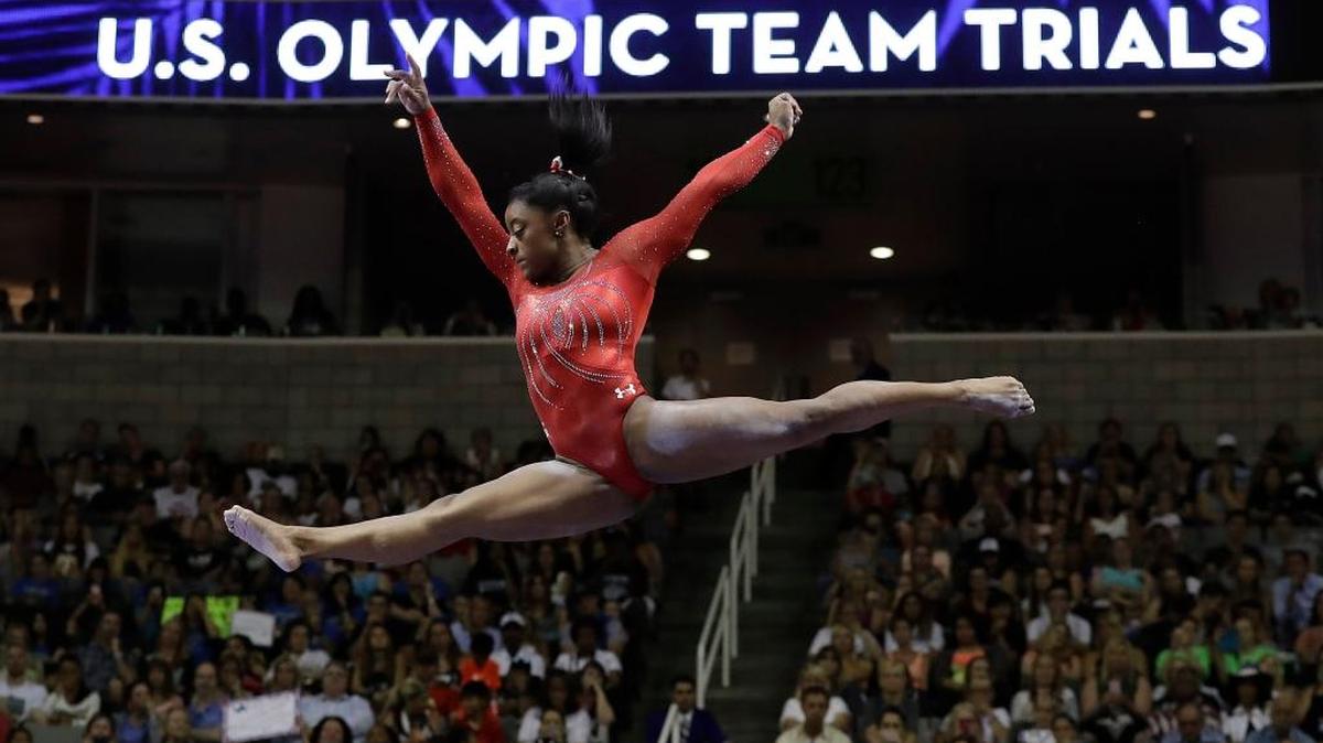 In this Sunday, July 10, file photo, Simone Biles competes on the balance beam during the women’s U.S. Olympic gymnastics trials in San Jose, Calif. It’s not one thing, the artistry, the athleticism, the smile. It’s all of it when it comes to Biles. Even Olympic champion Mary Lou Retton is in awe. “You can't teach that special unique quality that Simone has,” Retton says. “And she's got it.”