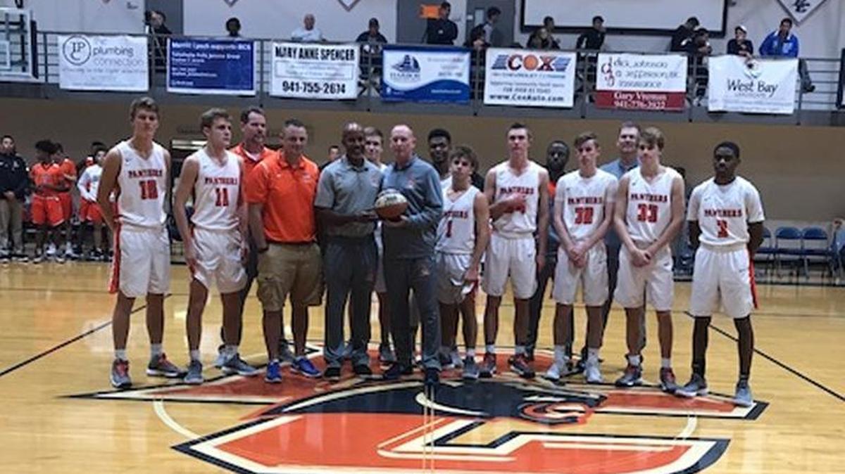 Bradenton Christian boys basketball coach Scott Townsend celebrated his 100th career victory prior to the Panthers game with Sarasota on Monday, Dec. 11, 2017.