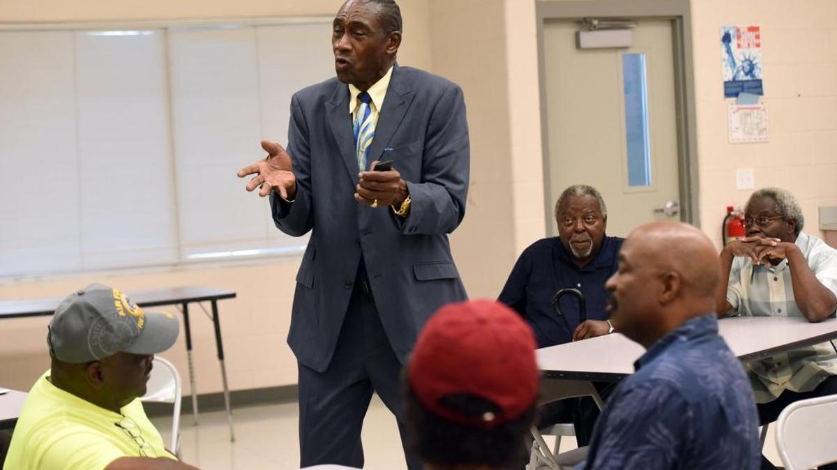 Ray Bellamy talks to his colleagues during a gathering earlier this year.