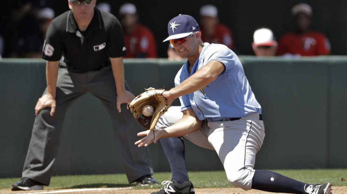 Tampa Bay Rays’ third baseman Kevin Padlo fields a ground ball by Minnesota Twins’ Miguel Sano during the second inning of a spring training game on March 28 in Fort Myers.