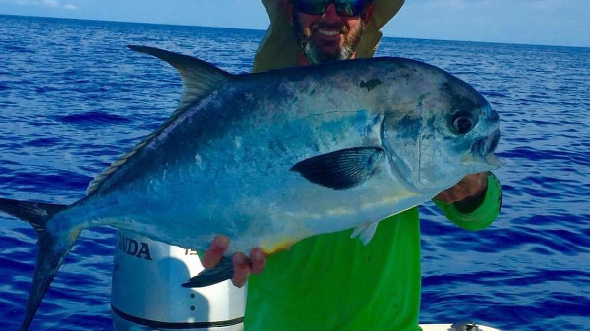 Capt. Josh Prunier holds a recently caught Gulf of Mexico permit.