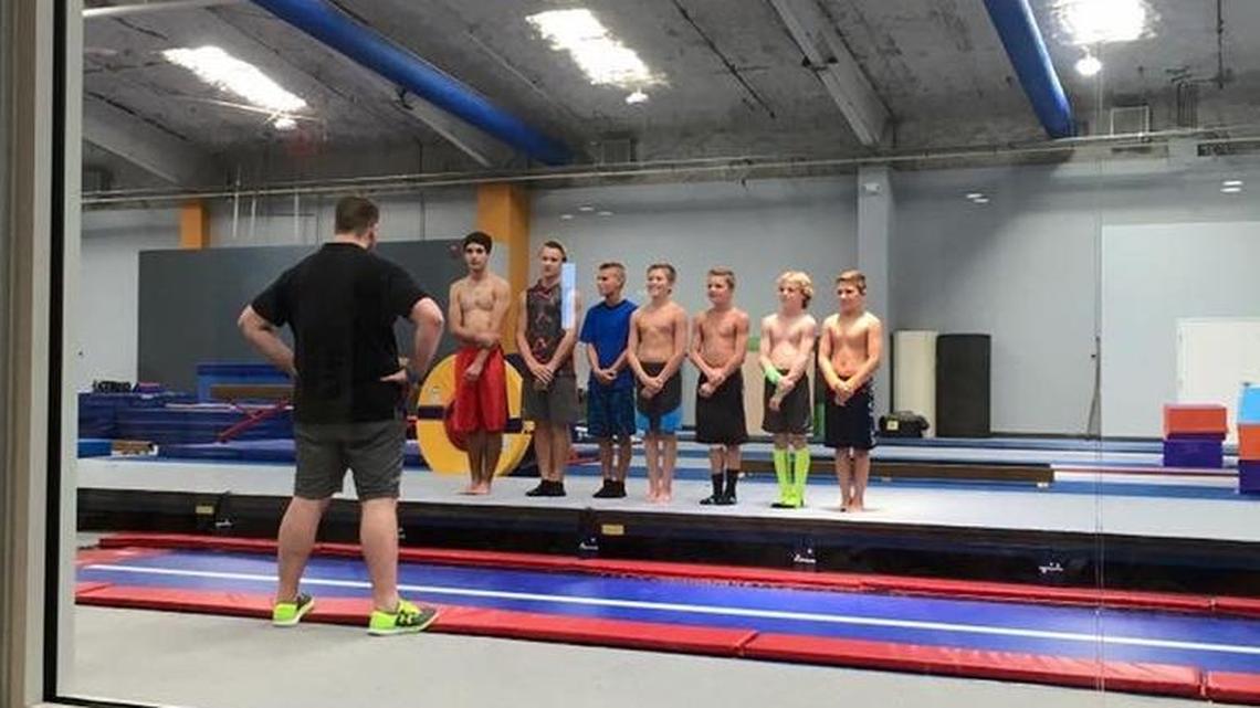 Jason Collins lines up some of his gymnasts following a pratice at Evo Athletics.