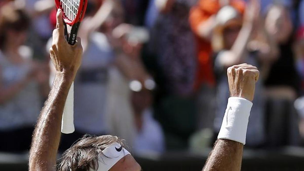 Roger Federer celebrates after beating Marin Cilic in their men’s singles match at Wimbledon on July 6.