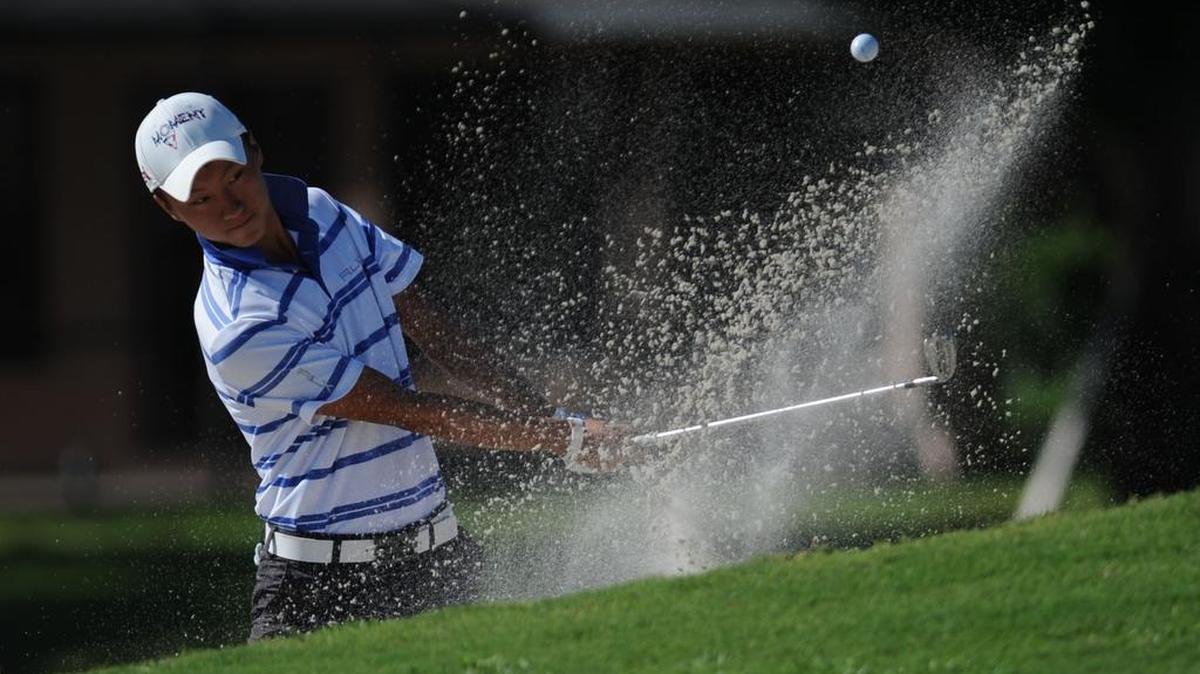 Alex Lee, of Orlando, hits out of a sand trap during the U.S. Junior Amateur Sectional qualifier golf tournament Tuesday at Palm-Aire Country Club.