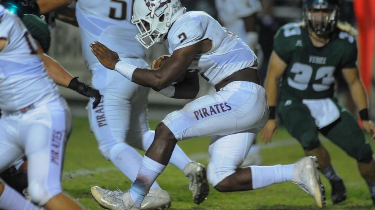 Braden River running back Deshaun Fenwick looks for an opening along the line during Friday’s Class 7A, Region 3 semifinal at Venice High School. The FHSAA unveiled its final playoff qualification system on Monday. The system takes effect next year.