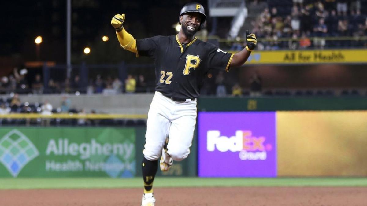 Pittsburgh Pirates' Andrew McCutchen celebrates as he heads to third base after hitting his first career grand-slam home run in the second inning of the baseball game against the Baltimore Orioles on Tuesday, Sept. 26, 2017, in Pittsburgh. (AP Photo/Keith Srakocic)