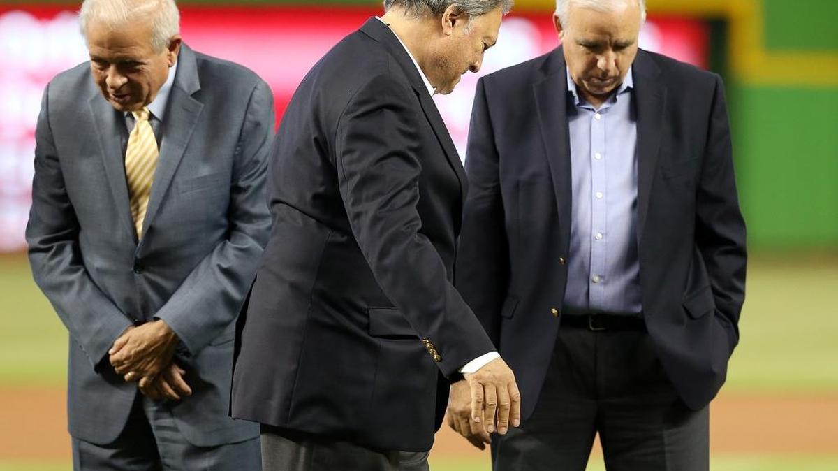 Miami Marlins owner Jeffrey Loria, center, walks by Miami-Dade County Mayor Carlos Gimenez, right, and Miami Mayor Tomas Regalado, during the unveiling ceremony of the official logo of the 2017 All-Star Game at Marlins Park. The ceremony took place before the Marlins-Phillies game on Wednesday, July 27, 2016.