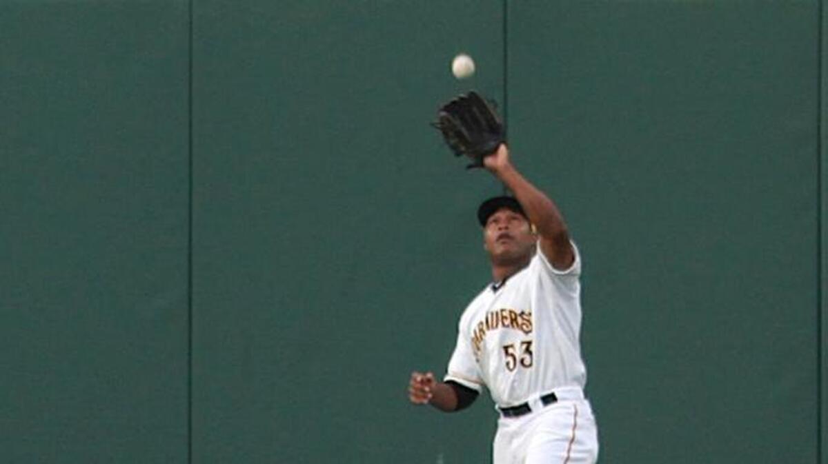 Outfielder Evan Chambers catches a flay ball during a June 29, 2011, game between the host Bradenton Marauders and the St. Lucie Mets. Chambers died in 2013.