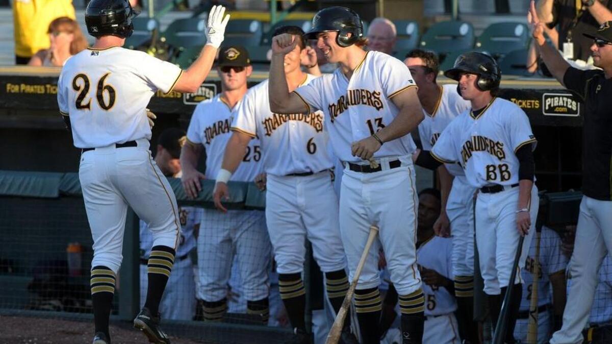 Jordan Luplow gets high-fives after crossing home plate during Game 2 of the FSL championship series.