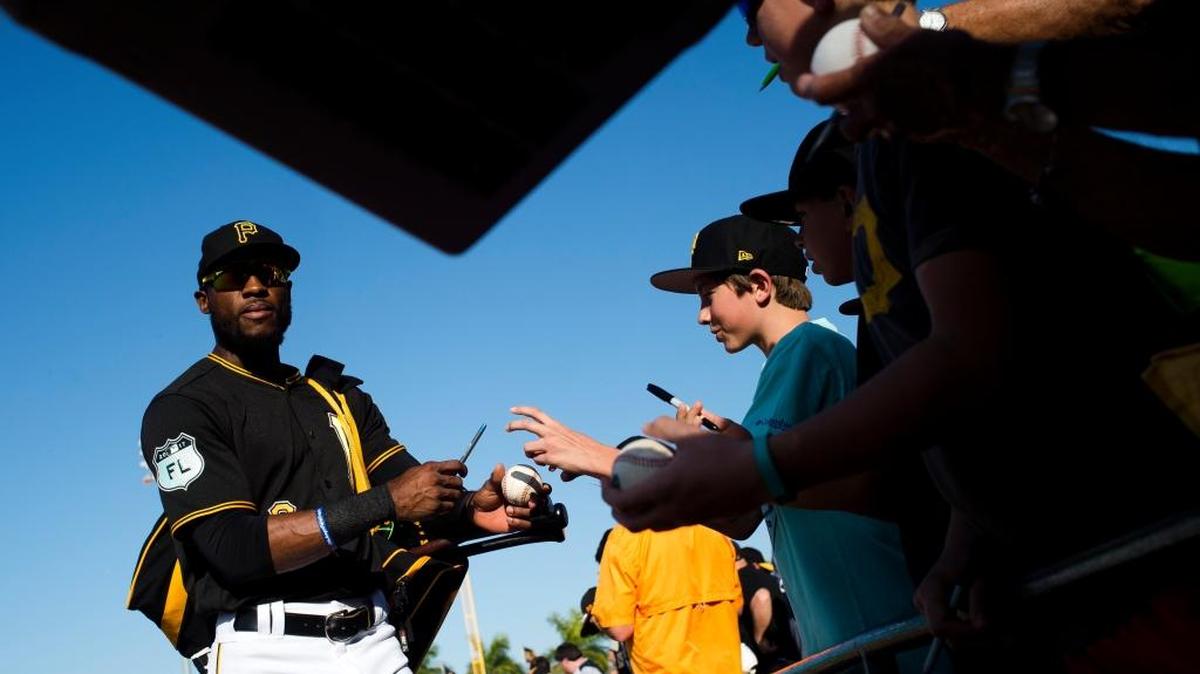 Pirates center fielder Starling Marte, shown here signing autographs during spring training, joined the Bradenton Marauders on Sunday as he begins to work himself back into game shape so he can rejoin the Pirates at the end of his 80-game suspension.