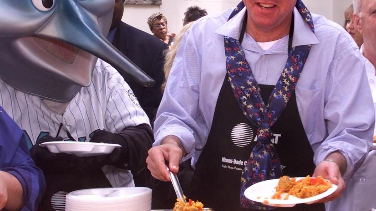 Gov. Jeb Bush, right, serves up a plate of paella with Billy, the Florida Marlins' mascot, during Dade County Days at the Capitol on Thursday, April 5, 2001, in Tallahasssee, Fla.