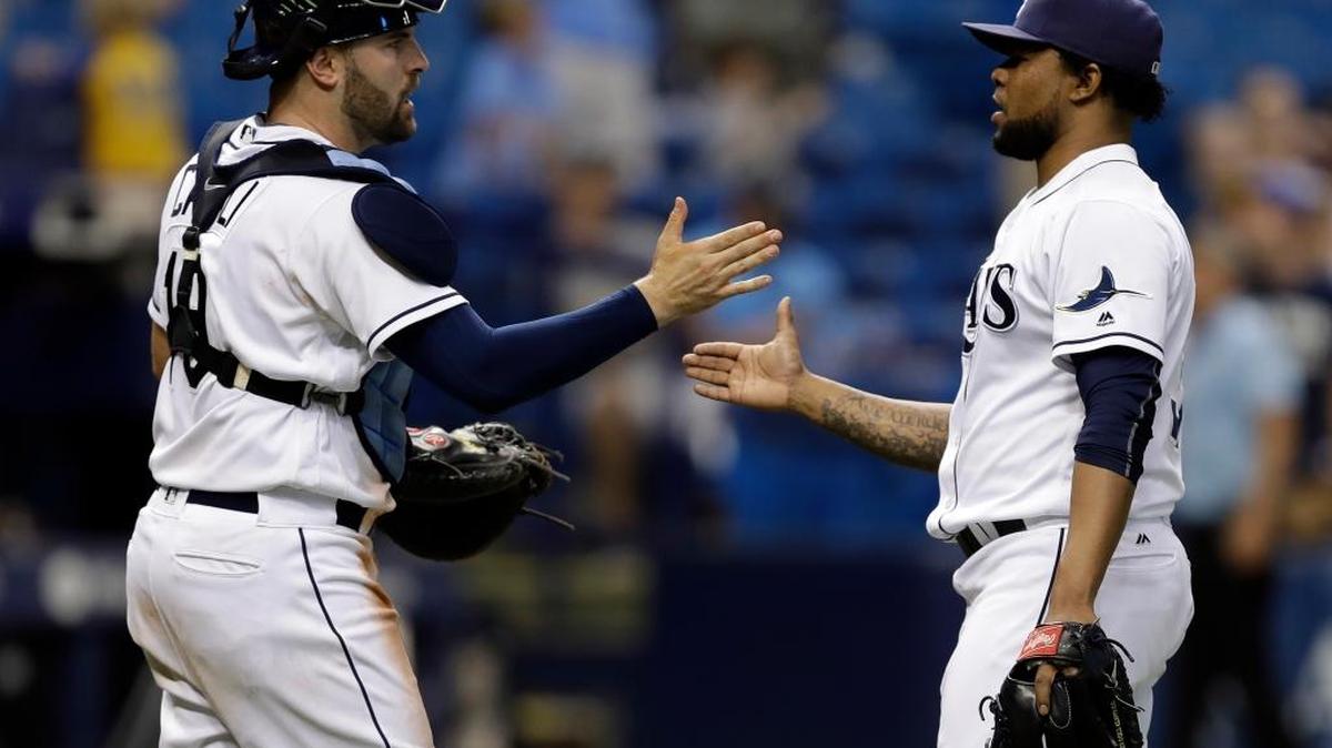 Tampa Bay Rays relief pitcher Alex Colome, right, shakes hands with catcher Curt Casali after a Sept. 22 game in St. Petersburg. Colome is one of nine arbitration-eligible players on the team with tendered contract offers.