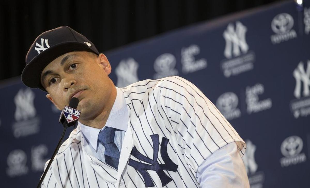 New Yankee Giancarlo Stanton answers questions after his trade from the Marlins.