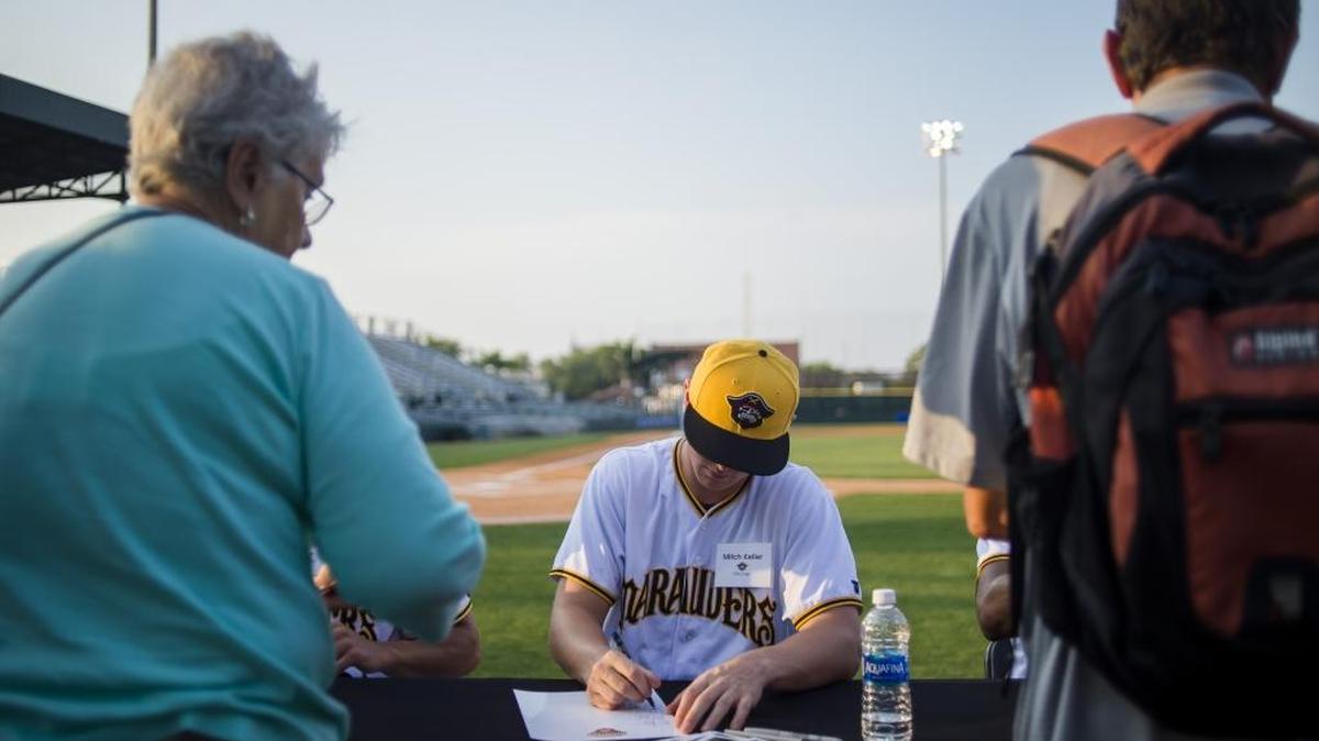 Marauders pitcher Mitch Keller signs autographs during the Meet the Marauders event on Tuesday evening at LECOM Park in Bradenton.