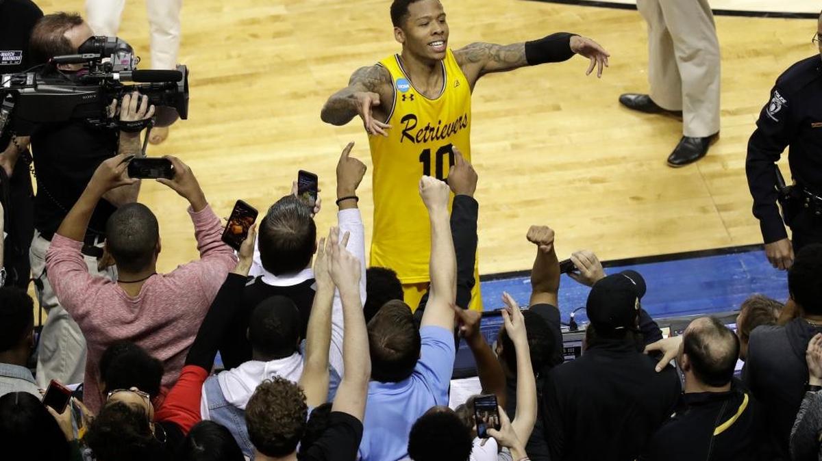 Jairus Lyles of the UMBC Retrievers celebrates with fans after the team’s 74-54 win over Virginia in a first-round game in the 2018 NCAA Tournament -- the only time a No. 16 seed has beaten a No. 1 seed.