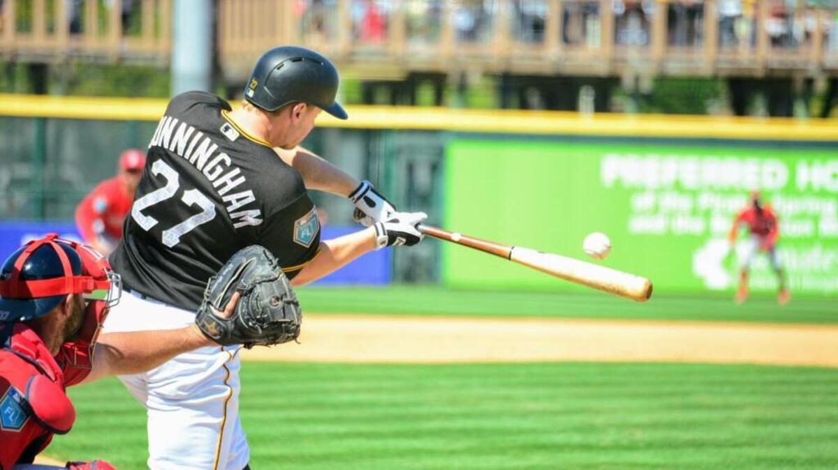 Todd Cunningham of the Pittsburgh Pirates makes contact during Sunday’s game against the Boston Red Sox at LECOM Park.