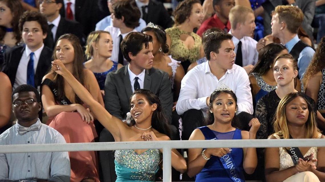 Homecoming court cheers the players at Manatee High's homecoming game against Steinbrenner High Friday at Hawkins Stadium.