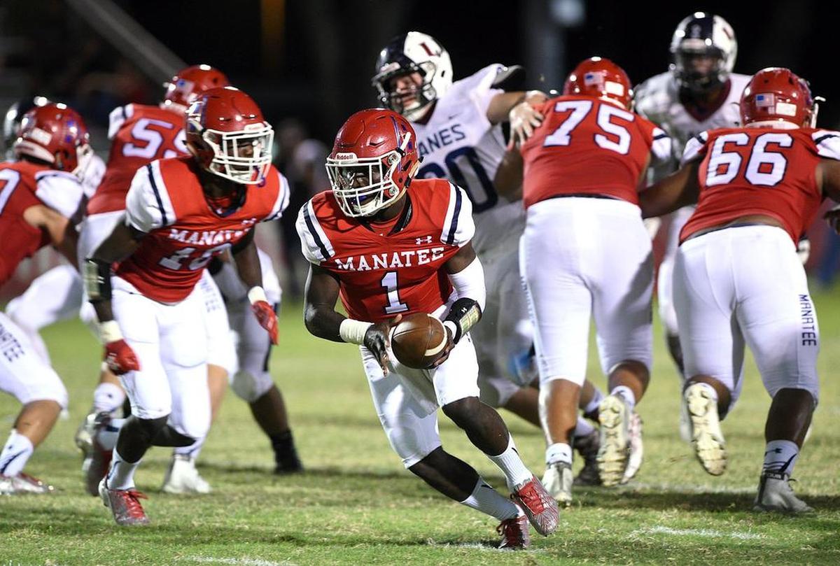 Manatee’s Keyon Fordham runs through the Palm Harbor’s defense during Friday night’s victory.