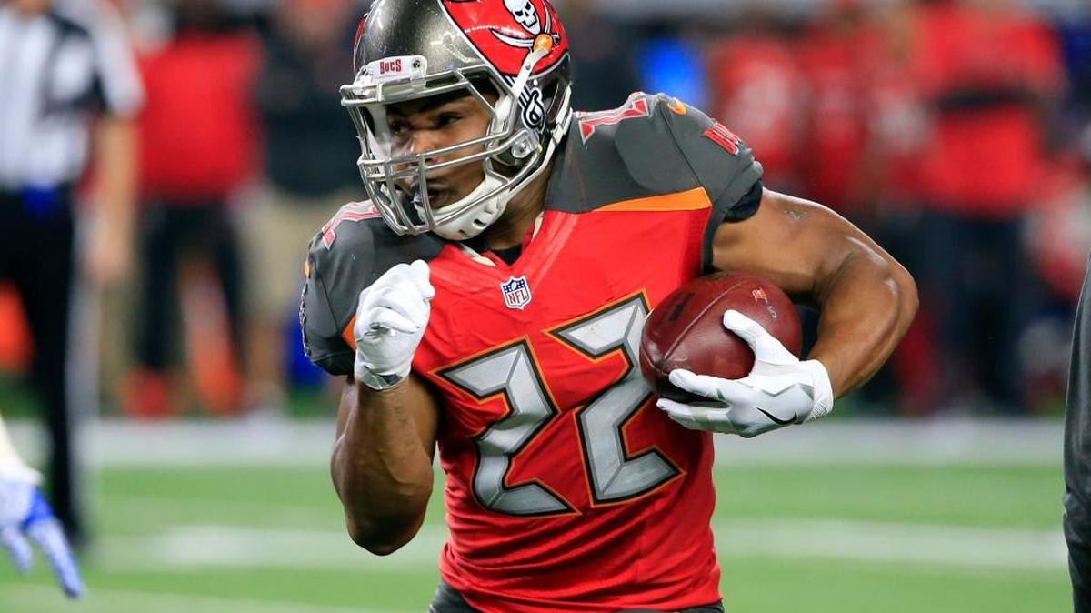 Tampa Bay Buccaneers running back Doug Martin carries the ball in the first half of Dec. 18 game against the host Dallas Cowboys. Martin suffered minor injuries in a crash Thursday, according to reports.