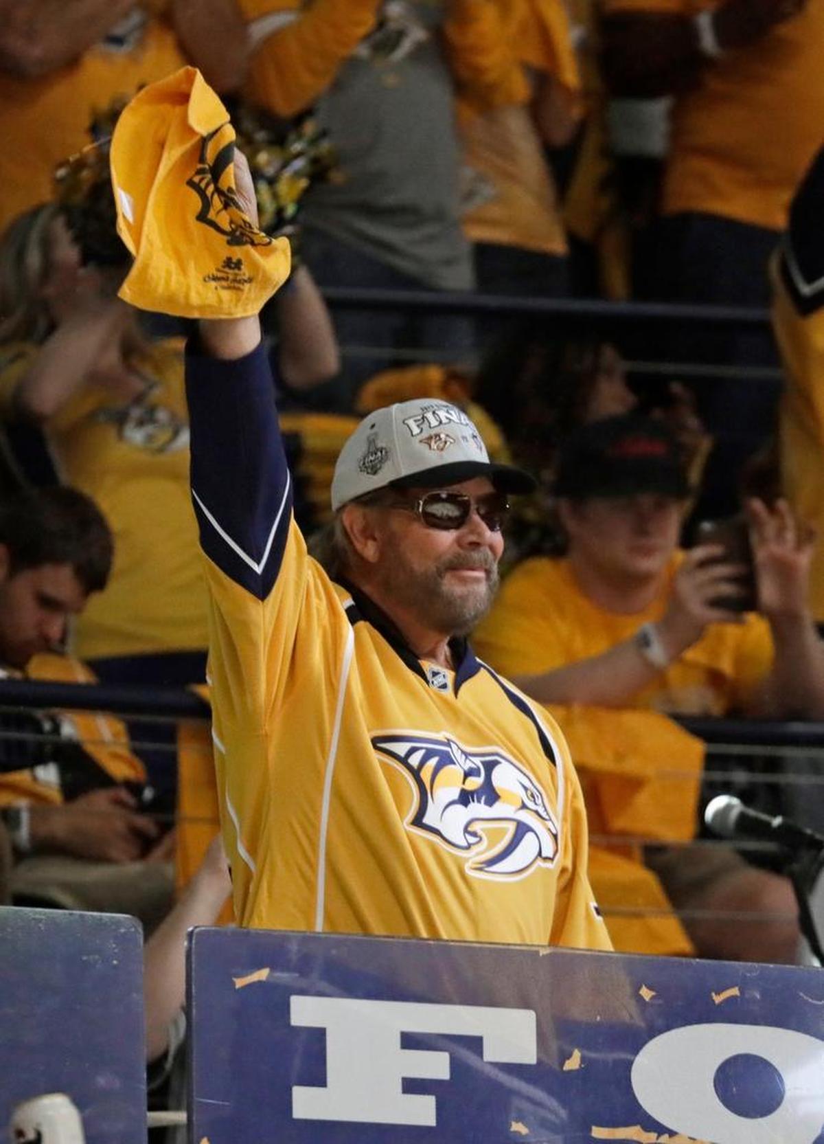 Musician Hank Williams Jr. waves the rally towel before the start of Game 3 of the NHL hockey Stanley Cup Finals between the Nashville Predators and the Pittsburgh Penguins Saturday, June 3, 2017, in Nashville.