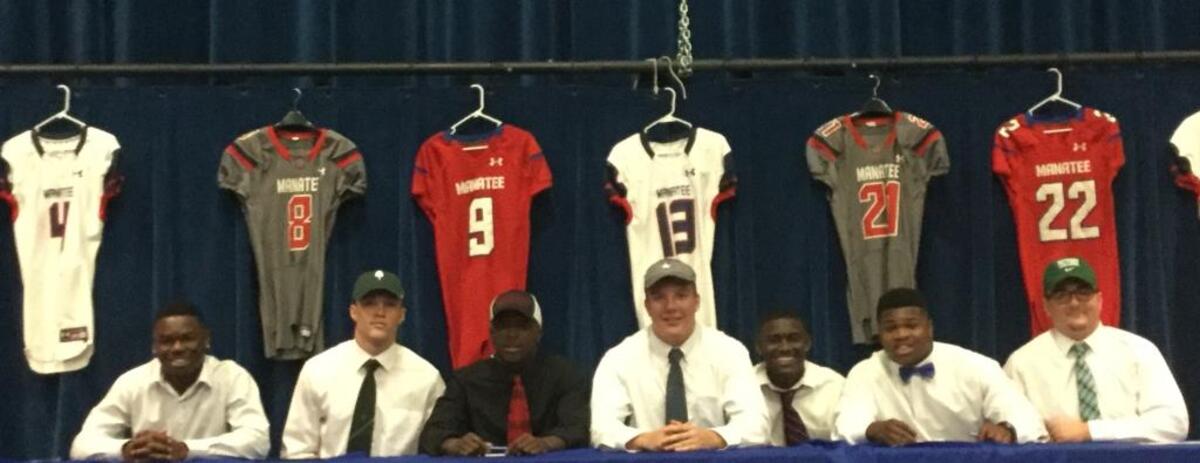 Manatee High had seven football players sign with colleges on National Signing Day. From left to right, Javarious Pollock (Dakota College), Josh Betts (Dartmouth), Sir Williams (Morningside College), Brett Gerber (Yale), Cedric Waters (ASA College), Josh Booker (Itasca Community College) and Dylan Spagnolo (Bethany College).