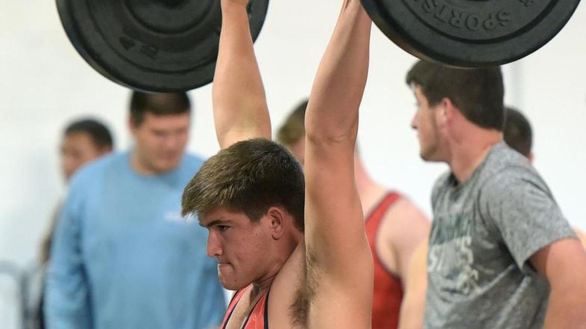 Manatee High School’s Jack Peebles performs a clean-and-jerk lift during the boys weightlifting championship meet at Manatee on Wednesday.