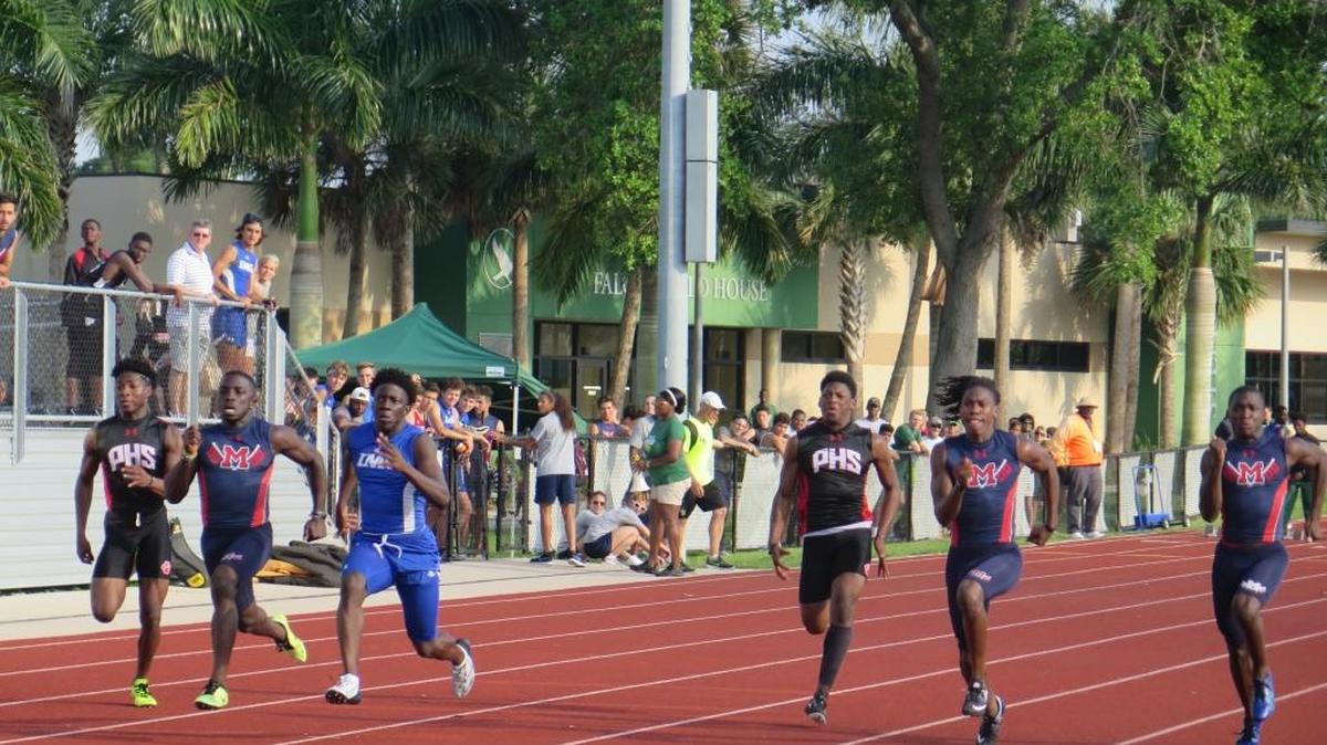 IMG Academy’s Rikkoi Brathwaite (third from left) leads the pack in the 100-meter dash at the Manatee County championships. Manatee’s Keyon Fordham (second from left) took second and teammate Tarique Milton (second from right) finished third.