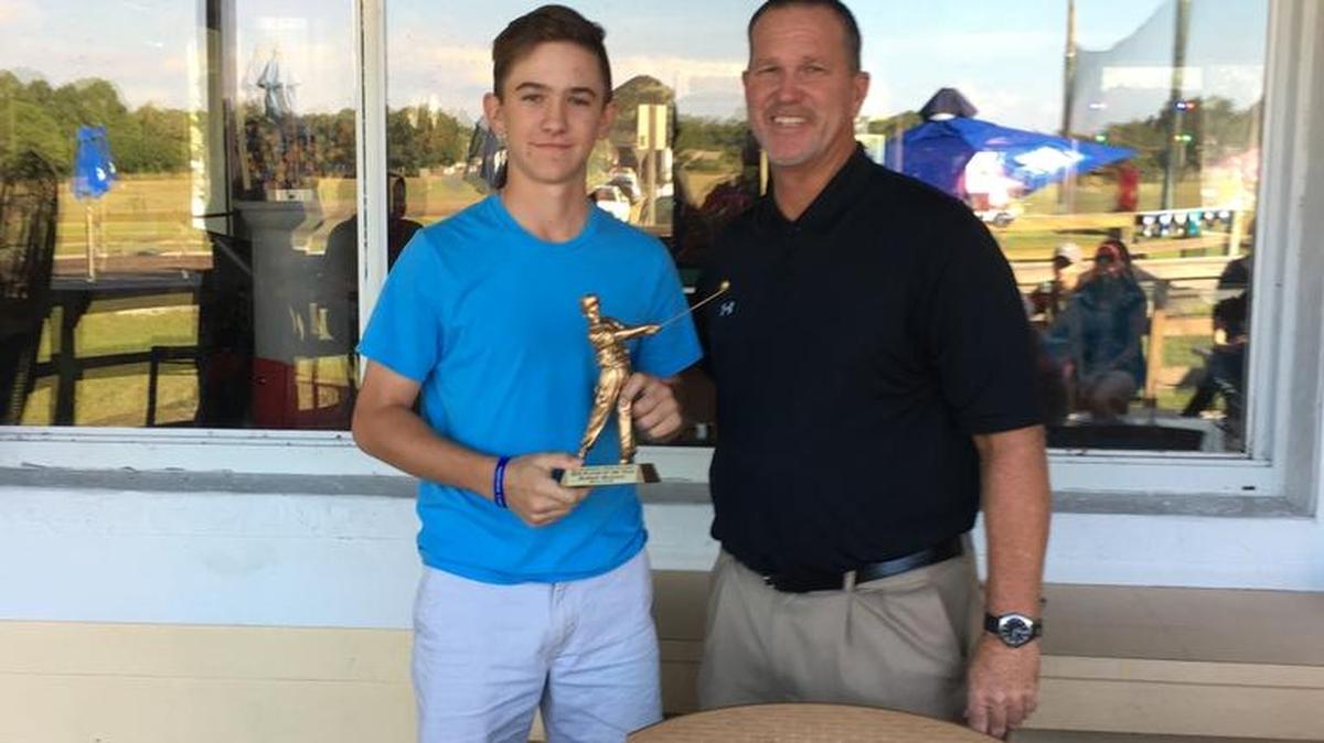 Bradenton’s’Robbie Higgins (left) stands with former PGA Tour pro Barry Cheesman with his boys 13-15 year old player of the year award at the Greater Sarasota Junior Golf Association's year-end banquet held in November.