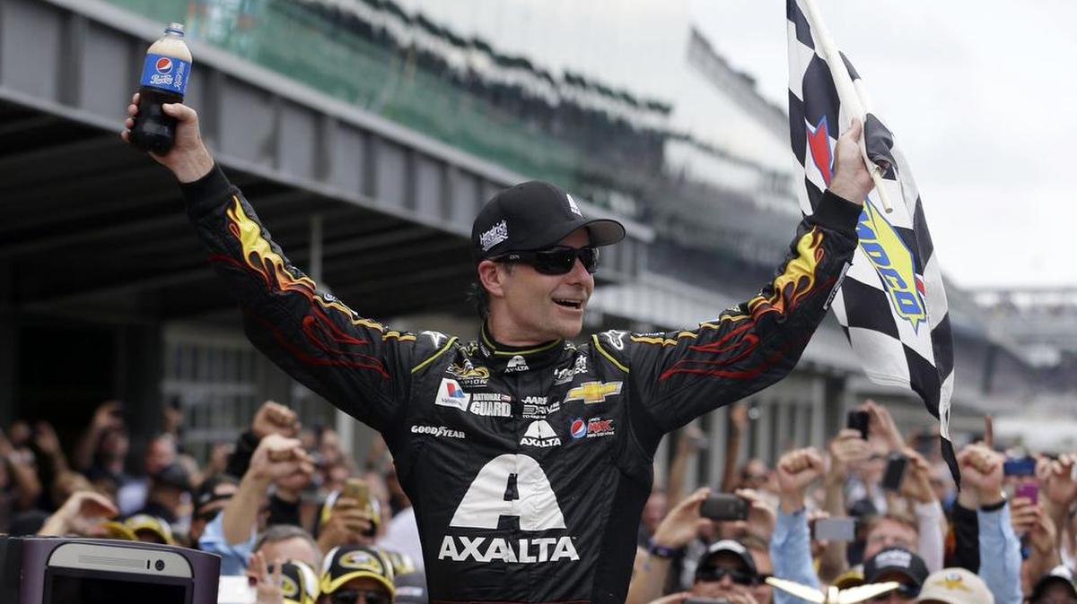 Jeff Gordon celebrates after winning the 2014 Brickyard 400 at Indianapolis Motor Speedway. Gordon will replace Dale Earnhardt Jr. in Sunday’s Cup race at Indy as Earnhardt battles balance issues and nausea.