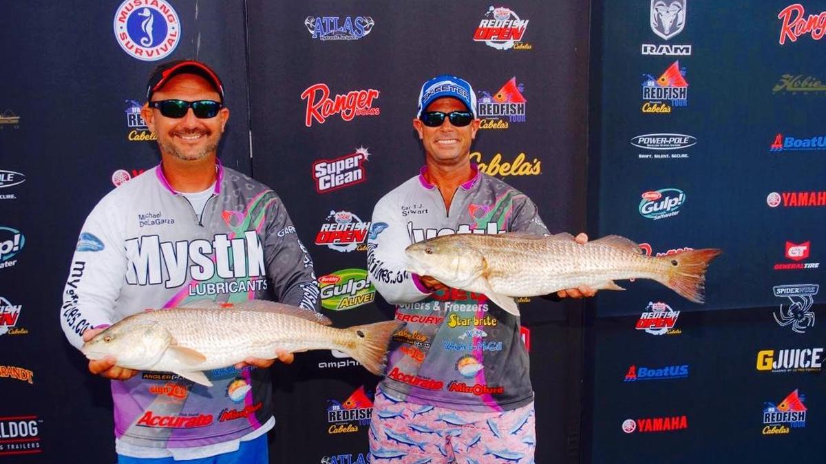 Michael Delagarza, left, and Capt. TJ Stewart show off the winning catch from the IFA Redfish Tour Sarasota event.