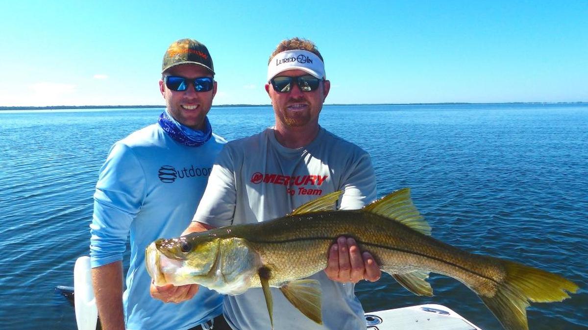 Capt. Jason Prieto holding a snook caught Thursday near Port Manatee.