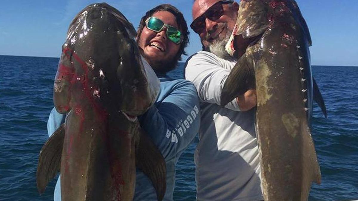 Joseph Brandenburg and friend show off a pair of cobia caught fishing on a wreck in 80 feet of water.