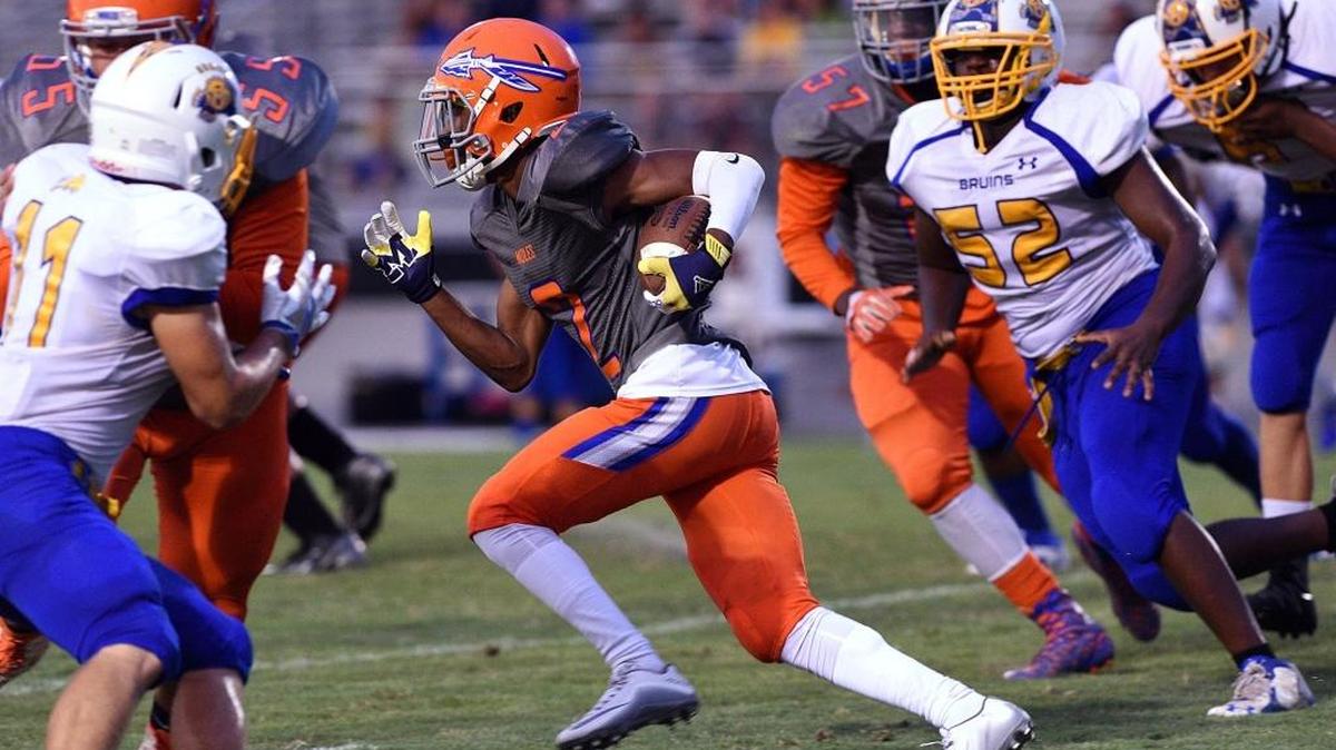Southeast’s Terrance Pryor finds a hole against the Bayshore defense during the first half of Friday’s game at John Kiker Memorial Field.