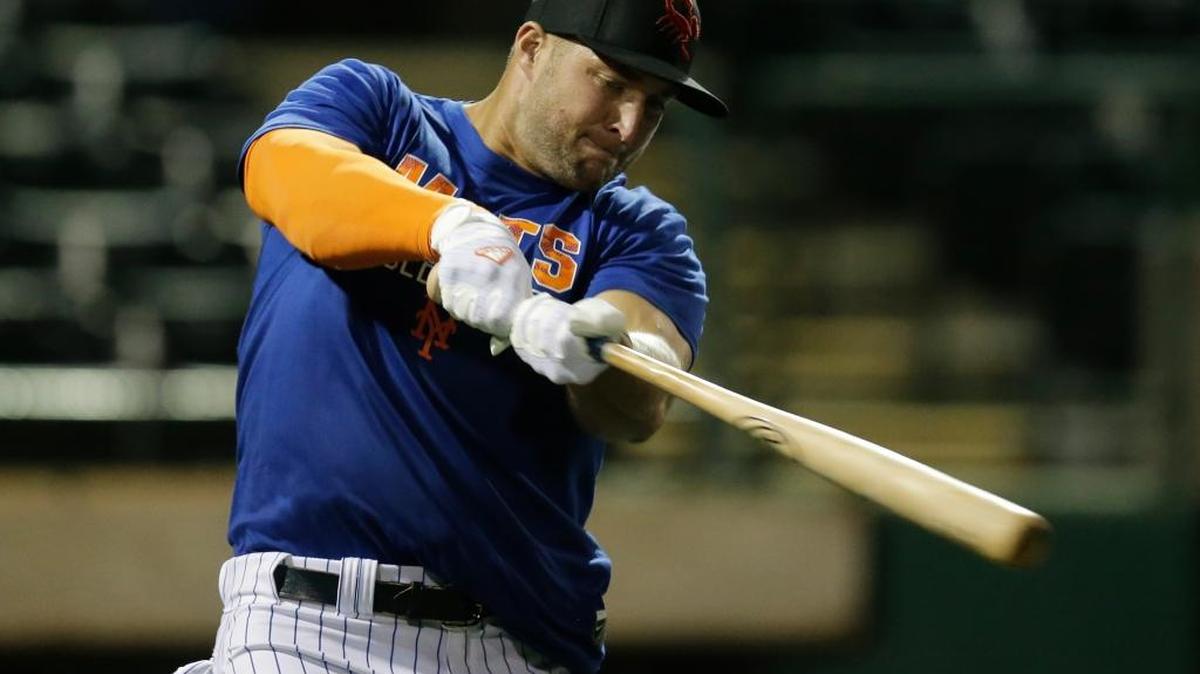 Former NFL quarterback Tim Tebow warms up before practice for the Arizona Fall league, Monday, Oct. 10, 2016, in Scottsdale, Arizona.