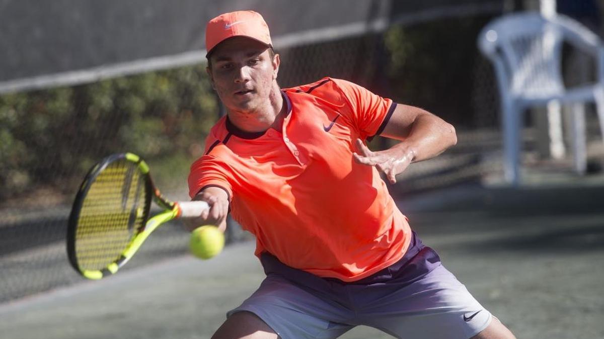 IMG Academy student Miomir Kecmanovic returns a powerful hit during the Eddie Herr Tennis Tournament semifinals Dec. 3 at IMG Academy in Bradenton. Kecmanovic won the Orange Bowl tournament on Sunday, giving him back-to-back wins in consecutive weeks.
