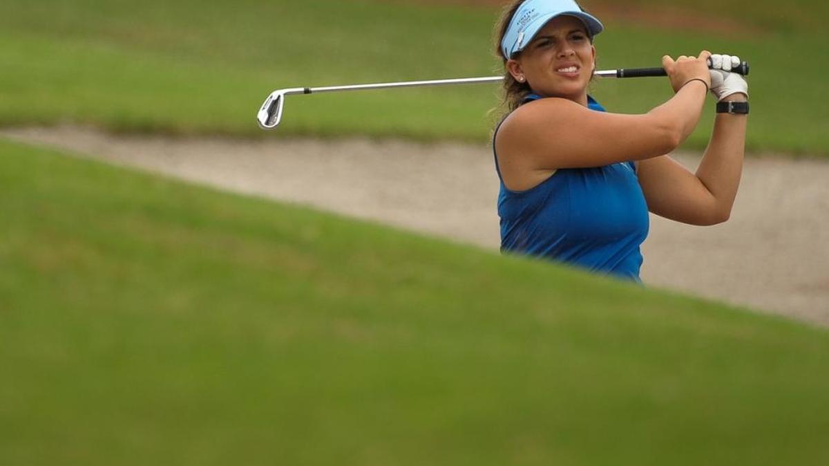 Jennifer Neville watches as her ball lands on the green during the U.S. Women’s Open sectional qualifier Monday at Bradenton Country Club.