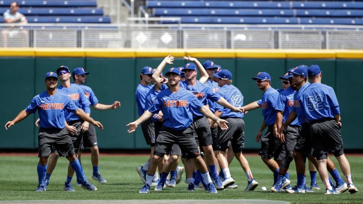 Florida players warm up at the beginning of a practice session in Omaha, Neb., on Friday. Florida plays TCU in the College World Series on Sunday.