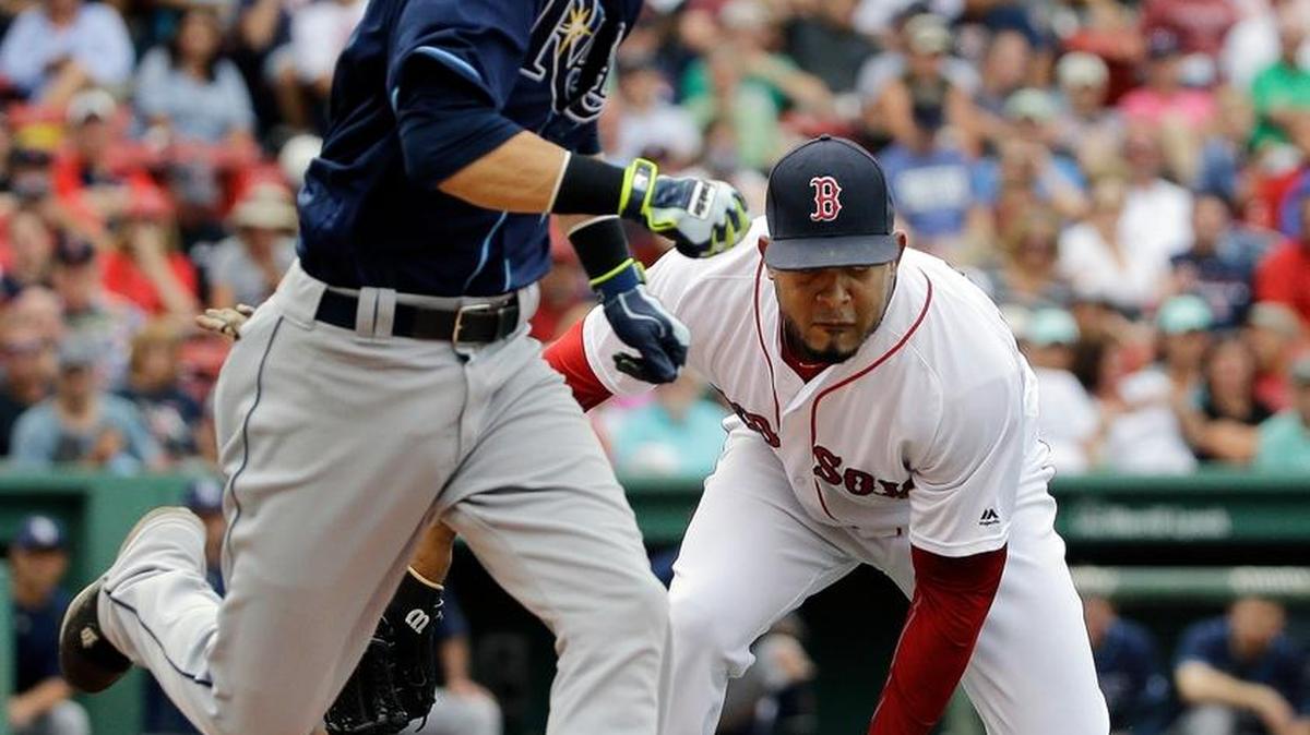Tampa Bay’s Nick Franklin runs to first for a single as Boston relief pitcher Fernando Abad fields the grounder in the eighth inning at Fenway Park Wednesday in Boston.
