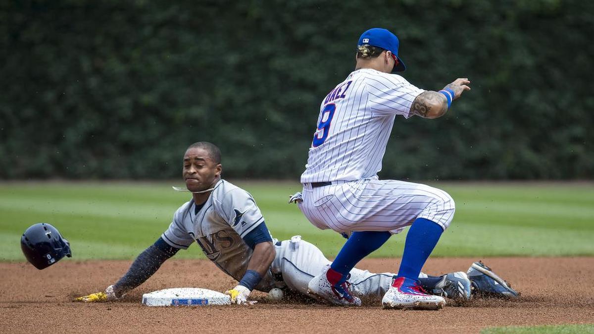 Tampa Bay Rays center fielder Mallex Smith steals second base ahead of Chicago Cubs second baseman Javier Baez making the tag in the first inning Wednesday at Wrigley Field in Chicago, Ill.