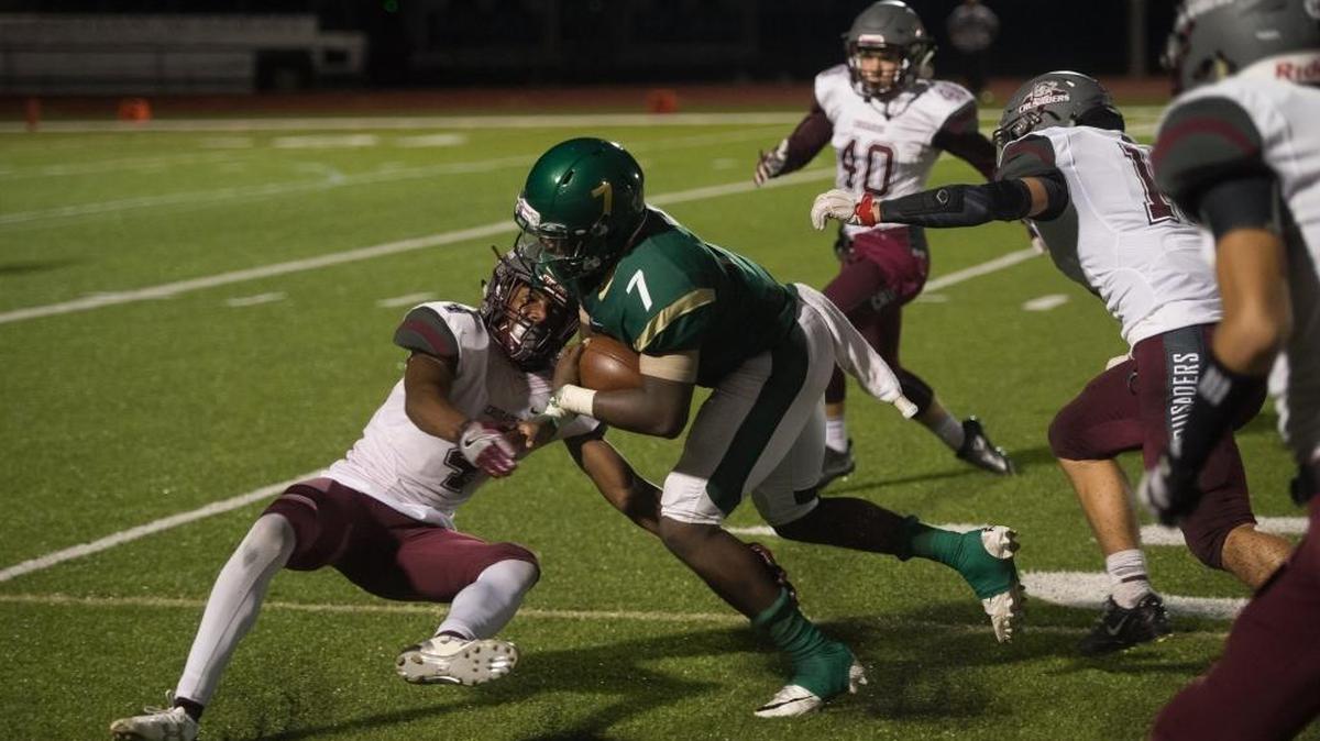 Saint Stephen's Fred Billy plows through Seffner defenders last season. Billy is among those returning players for the Falcons who will be going through spring practice sessions over the few weeks.