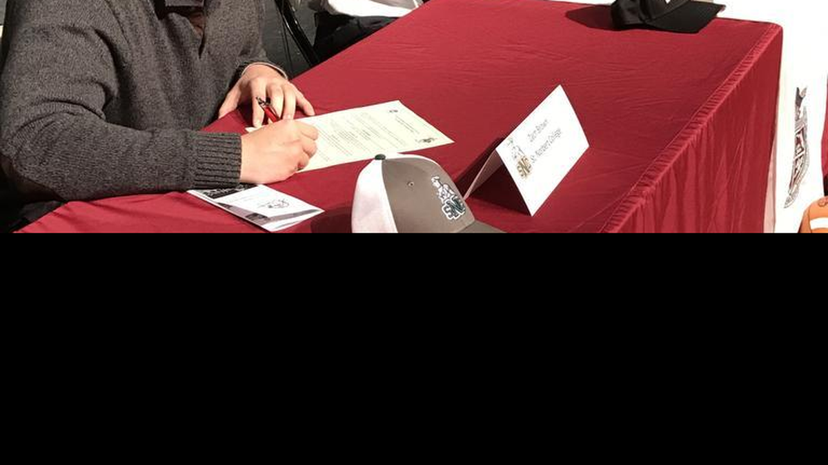 Quarterback Louis Colosimo (Bryant), Raymond Thomas (Northwest Missouri State) and Zach Brown (St. Norbert College) sign letters of intent Wednesday morning.