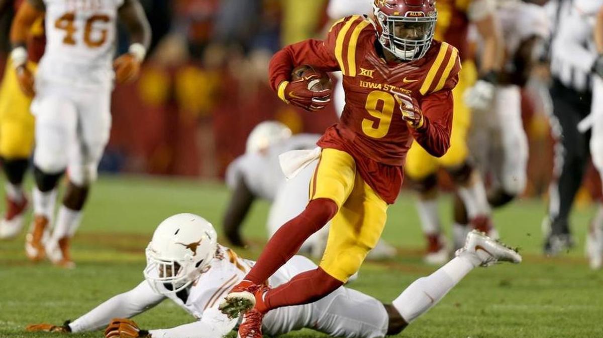 Iowa State wide receiver Quenton Bundrage (9) gets away from Texas cornerback Antwuan Davis during the first half of an NCAA college football game, Saturday, Oct. 31, 2015, in Ames, Iowa.