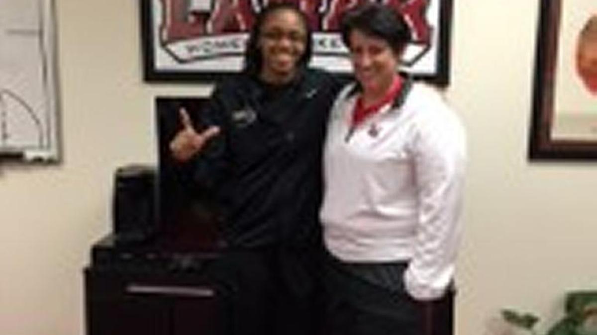 DeAngela Mathis and Lamar head coach Robin Harmony.