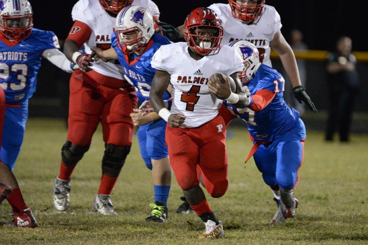 Palmetto running back Elijah Davis looks for daylight during Friday’s Class 7A-Region 3 playoff game.