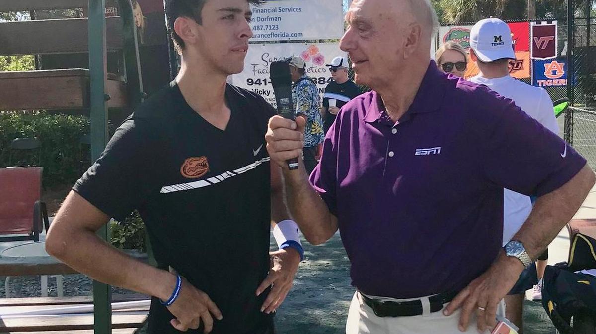 Sports broadcaster Dick Vitale interviews Andres Andrade after the Florida Gators tennis player and IMG Academy alum won the men’s singles title Sunday at the annual Dick Vitale Intercollegiate Clay Court Championship at the Lakewood Ranch Tennis Center.