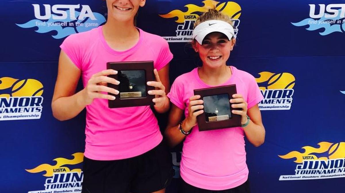 Ava Krug of Lakewood Ranch, left, and Liv Hovde of Texas, teamed up to win the USTA National Doubles Championships on Saturday in Orlando in the 14 and Under division.